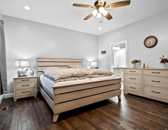 bedroom with dark hardwood / wood-style floors and ceiling fan