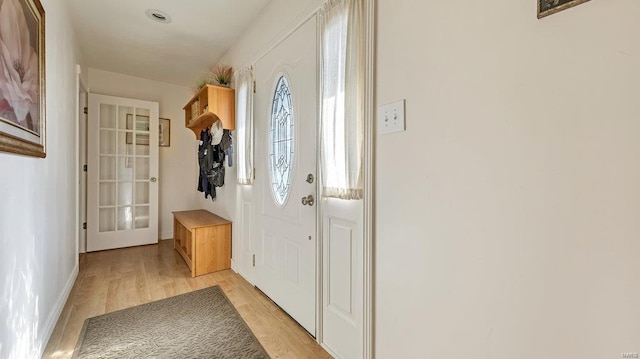 doorway with light hardwood / wood-style flooring