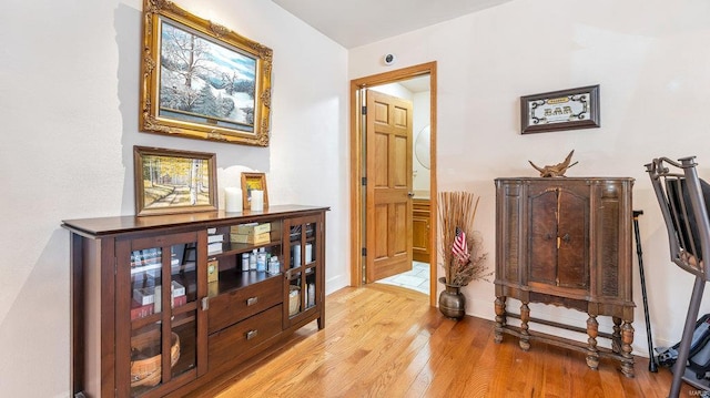 corridor featuring light hardwood / wood-style floors