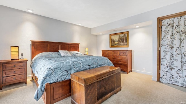 bedroom with light colored carpet