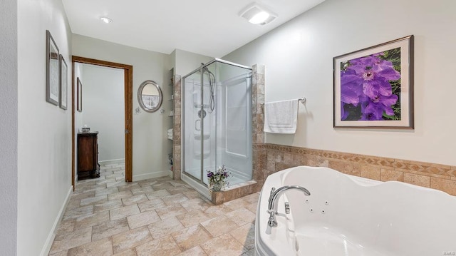 bathroom featuring plus walk in shower