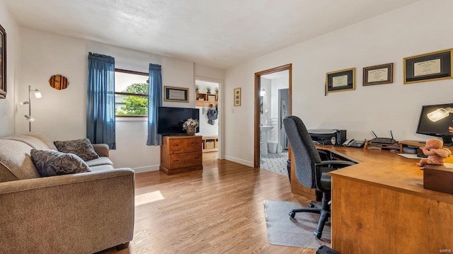 office space with light hardwood / wood-style flooring