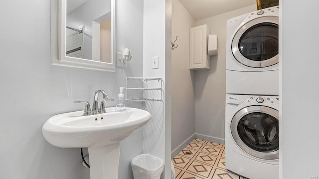 washroom featuring stacked washer and dryer