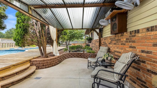 view of patio / terrace with a swimming pool side deck