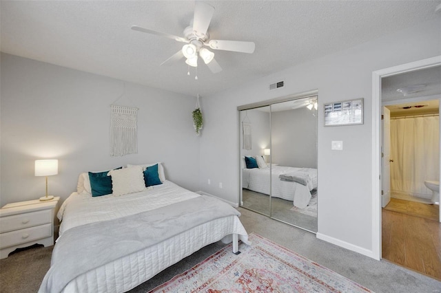 bedroom featuring a textured ceiling, a closet, ceiling fan, and carpet flooring