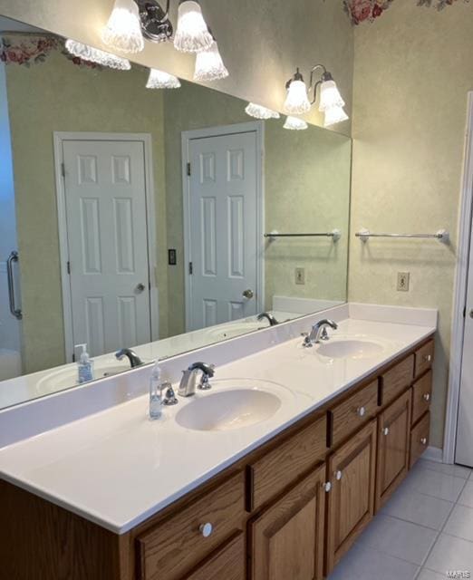 bathroom with tile patterned flooring and vanity