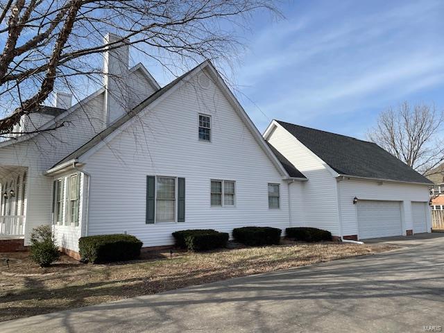 view of side of property featuring a garage