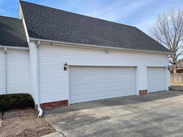 exterior space featuring an outbuilding and a garage