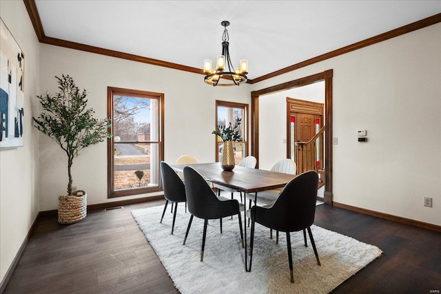 dining room with visible vents, ornamental molding, dark wood finished floors, an inviting chandelier, and baseboards