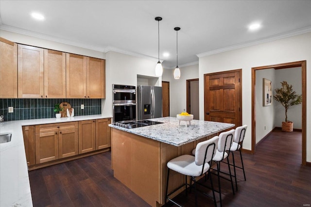 kitchen featuring dark wood-type flooring, a kitchen island, backsplash, and stainless steel appliances