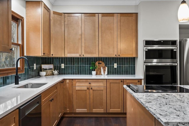 kitchen featuring light stone counters, dark wood-style floors, a sink, decorative backsplash, and black appliances