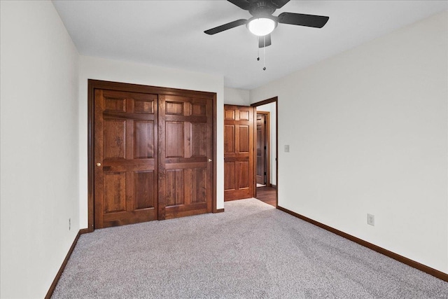 unfurnished bedroom featuring a ceiling fan, baseboards, and carpet floors