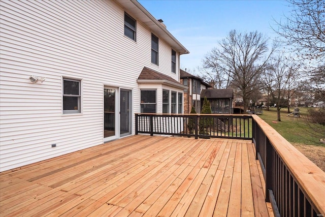 wooden terrace featuring a yard