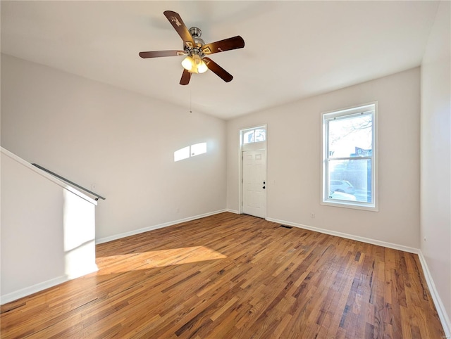 interior space with hardwood / wood-style floors and ceiling fan