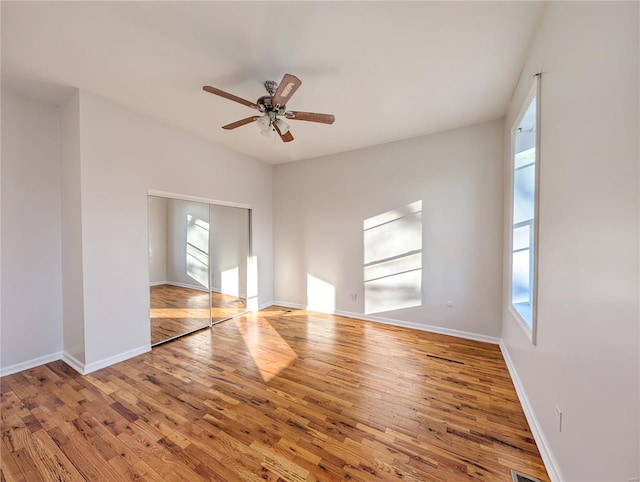 spare room featuring ceiling fan and light hardwood / wood-style flooring