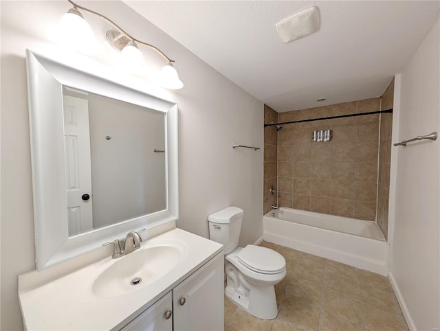 full bathroom featuring vanity, tiled shower / bath combo, and toilet