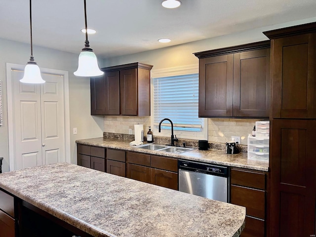 kitchen featuring sink, dishwasher, hanging light fixtures, dark brown cabinets, and tasteful backsplash