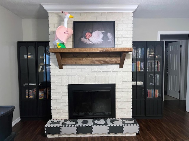 interior details featuring hardwood / wood-style flooring and a fireplace