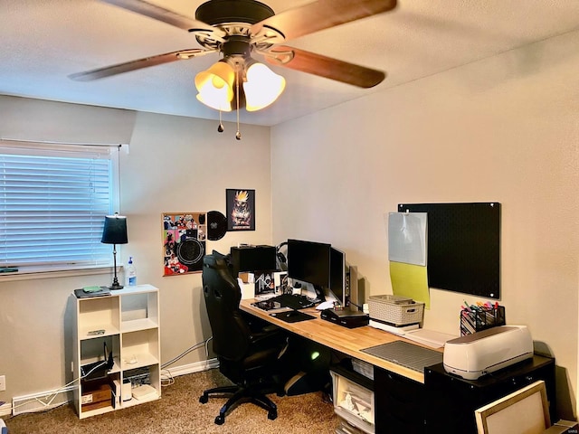 office area featuring dark carpet and ceiling fan