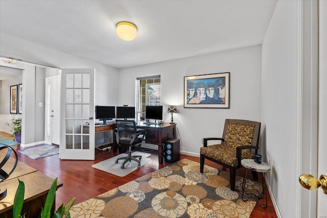 office with french doors and dark hardwood / wood-style floors