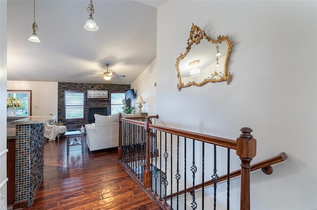 hall featuring lofted ceiling and dark hardwood / wood-style floors