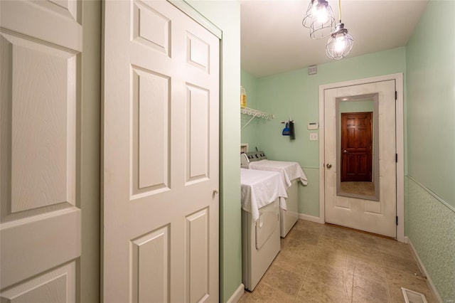 washroom featuring separate washer and dryer