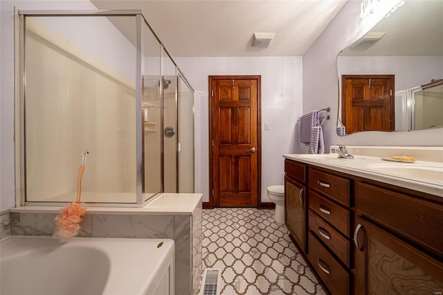 full bathroom featuring shower with separate bathtub, vanity, and toilet