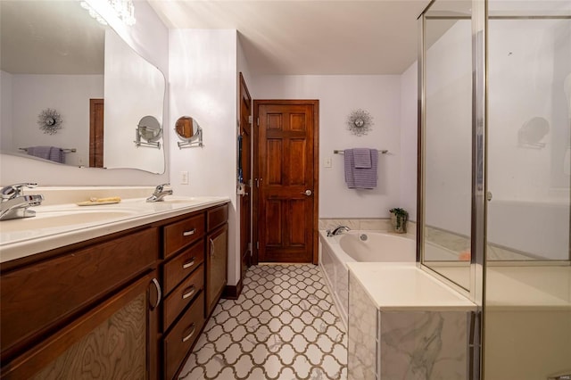 bathroom with vanity and independent shower and bath