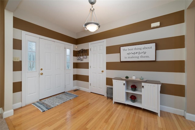 foyer with hardwood / wood-style flooring