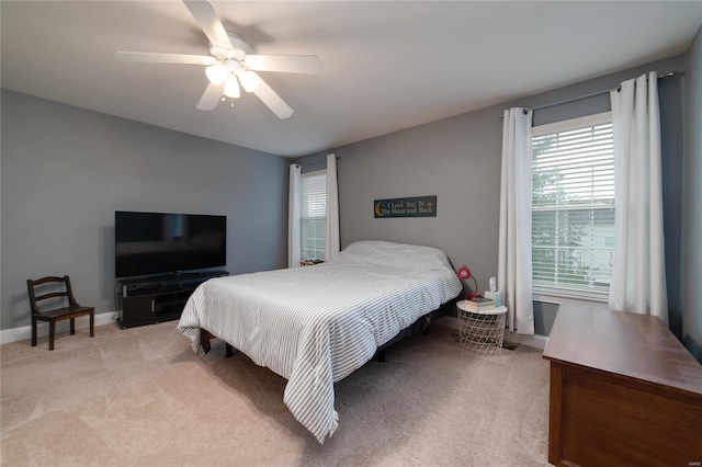 bedroom featuring ceiling fan and light colored carpet