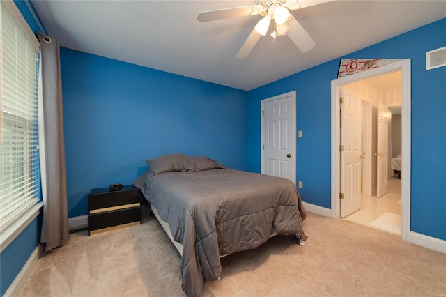 bedroom featuring light carpet and ceiling fan