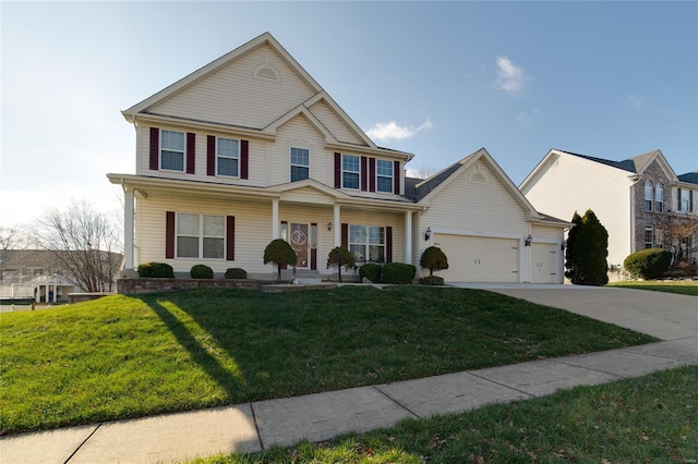 view of front of house featuring a porch, a garage, and a front yard