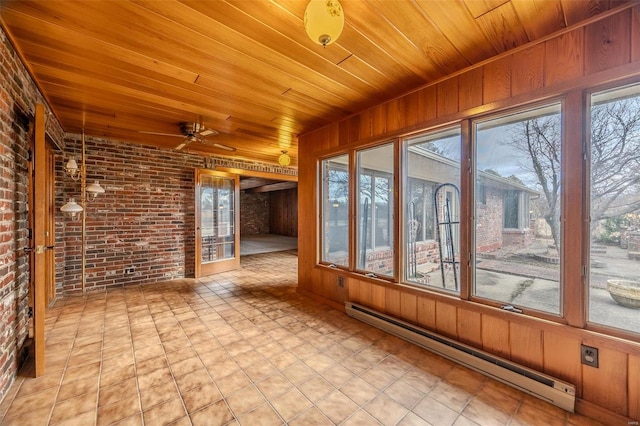 unfurnished sunroom featuring ceiling fan, wooden ceiling, and a baseboard heating unit