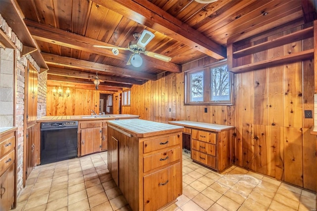 kitchen with beamed ceiling, dishwasher, sink, a center island, and tile counters