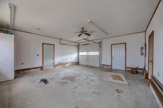 garage featuring baseboard heating