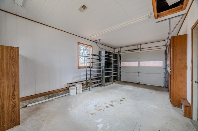 garage with wood walls