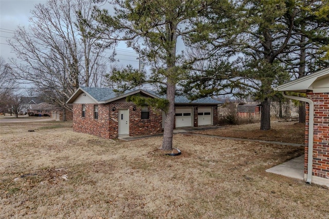 view of home's exterior featuring a garage and a yard