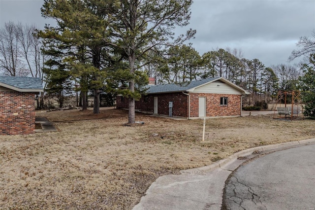 view of property exterior featuring a lawn