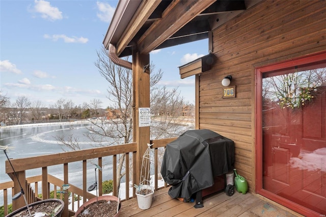 snow covered deck featuring grilling area