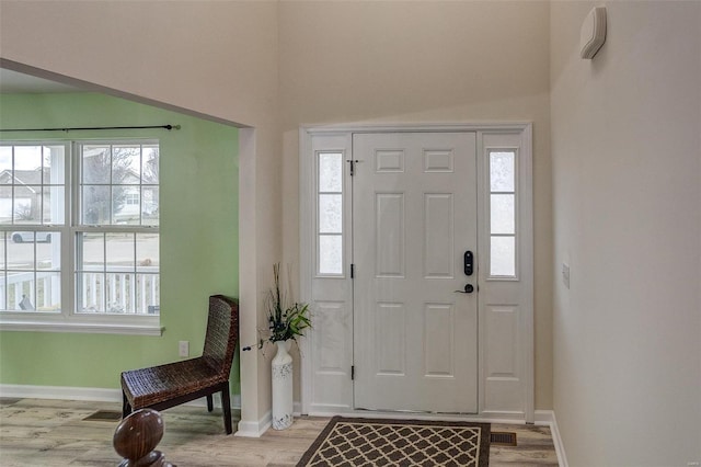 foyer with light wood-type flooring