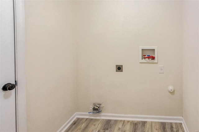 laundry room featuring electric dryer hookup, washer hookup, and light hardwood / wood-style flooring