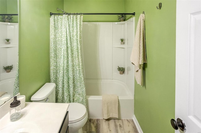 full bathroom featuring vanity, toilet, hardwood / wood-style floors, and shower / bath combo