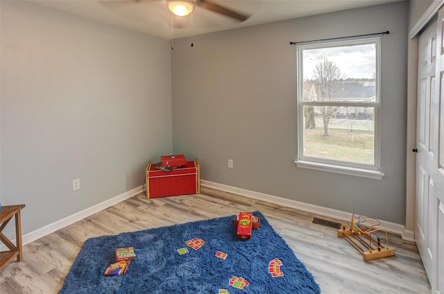 recreation room featuring hardwood / wood-style flooring and ceiling fan