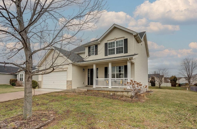 view of front of house with a porch, a garage, and a front lawn