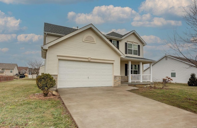 traditional home with covered porch, a garage, stone siding, driveway, and a front yard