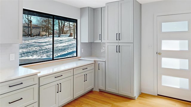 kitchen featuring backsplash and light hardwood / wood-style floors