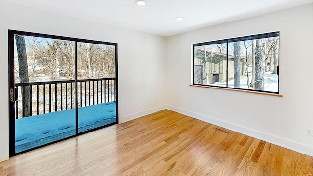 spare room featuring hardwood / wood-style flooring