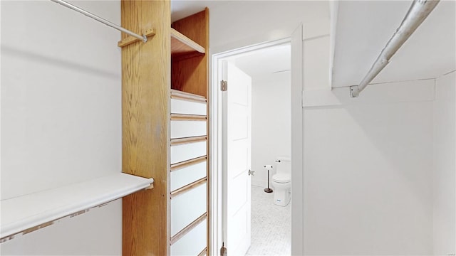 spacious closet with tile patterned flooring