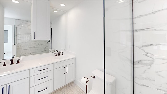 bathroom featuring tasteful backsplash, vanity, and a shower