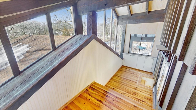 staircase with hardwood / wood-style floors